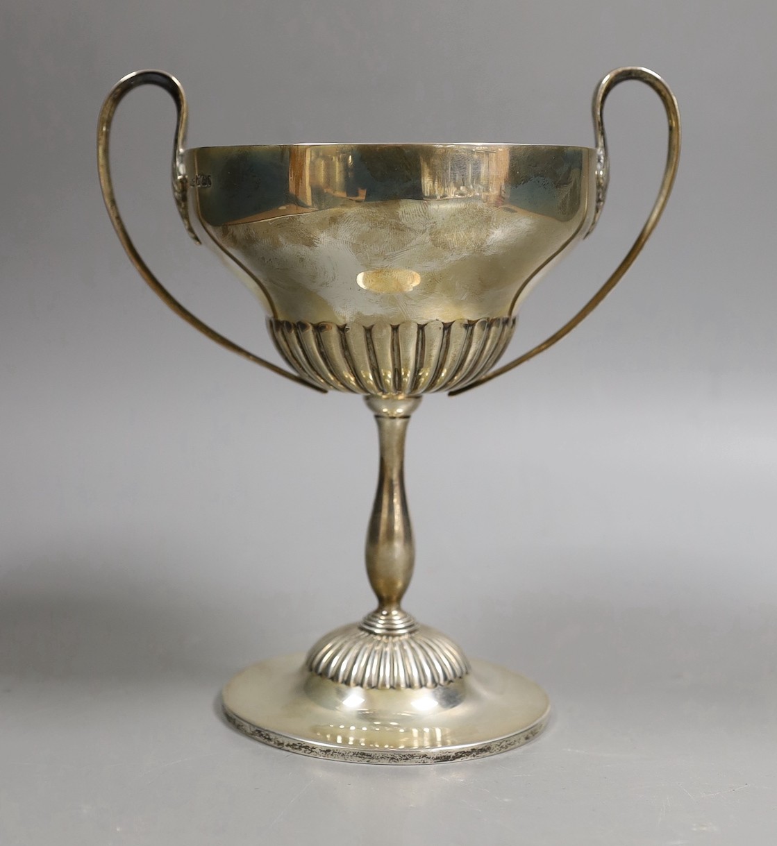 An Edwardian demi fluted silver two handled trophy cup, by Mappin & Webb, Sheffield, 1901, with later engraved horse racing inscription, height 20.1cm, 13.6oz.
